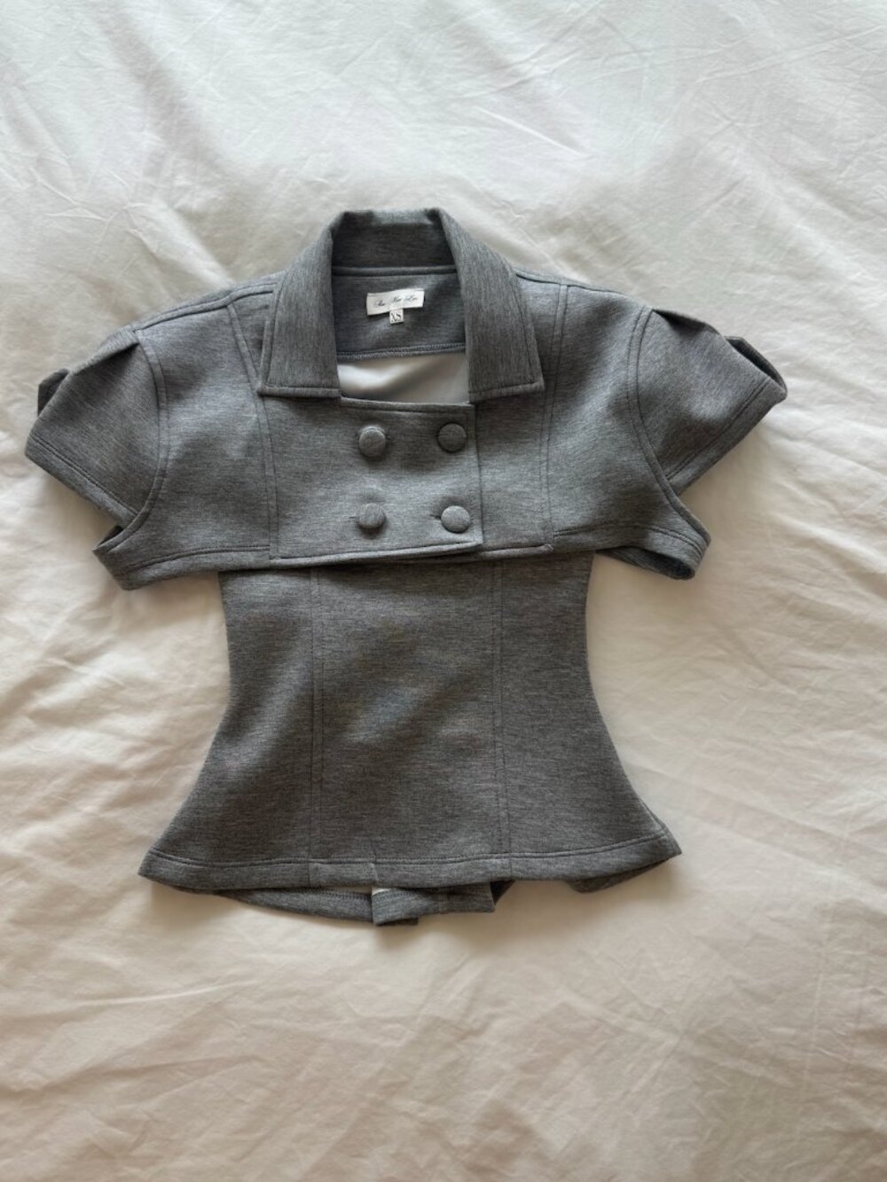 Gray double breasted top with corset bottom and button detail